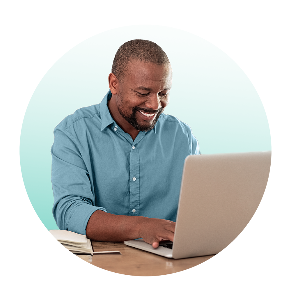 m-aa-blue-shirt-grad HR employee on laptop.